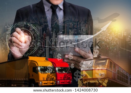 Double exposure concept.  Business hands using tablet on abstract city background.Technology and network interface icon.