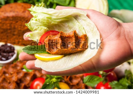 detail shot of chef hands offering raw dumplings into belly cucumber detail shot background raw dumplings countertop image eating wonderful composition conceptual shot buy Turkish cuisine