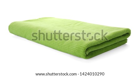 Fresh folded towel isolated on white. Beach accessories