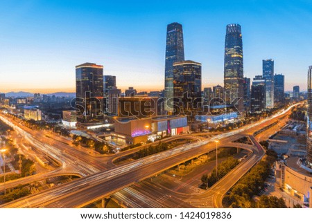 High-rise buildings and viaducts in the financial district of the city, night view of Beijing, China