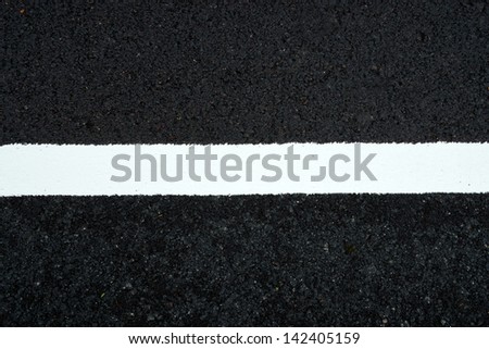 White Traffic lines on the road.