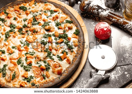 cooking pizza with salmon tomatoes and fresh herbs