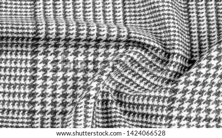 Background texture, pattern. The fabric is thick, warm with a checkered pattern, gray black. This is an unforgettable encounter with my fabric. The best design solutions are waiting for you.