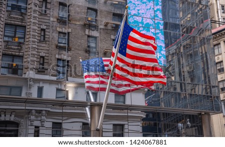 USA symbol in New York streets. American flag in Manhattan downtown, reflections on the glass