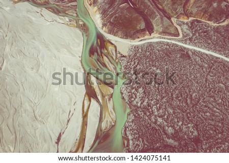 Landmannalaugar National Park - Iceland. Rainbow Mountains. Aerial view of amazing glacier river patterns. Top view. Picture made by drone from above.