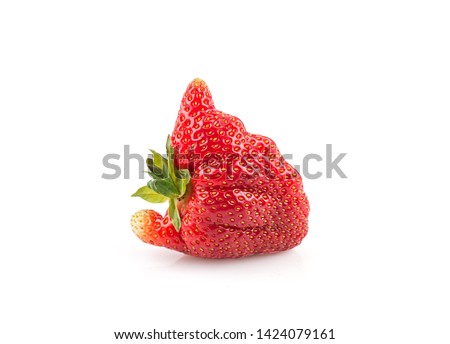 Ugly organic home grown strawberry isolated on white background.Trendy ugly food.Strange funny imperfect fruit .Misshapen produce, food waste concept. Top view, copy space. Royalty-Free Stock Photo #1424079161