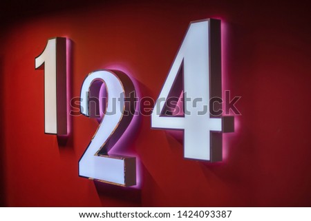 numbers 1, 2 and 4 on the wall