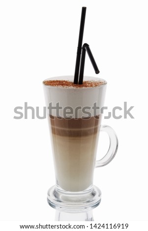 Cappuccino in tall glass isolated on white background