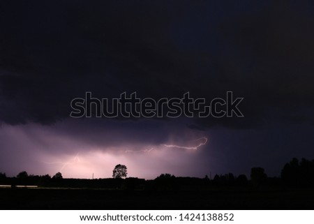 Night lightning and thunderstorms on the field