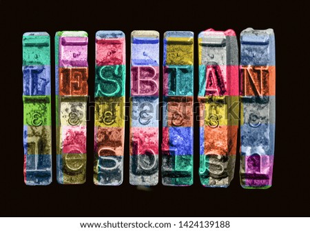 the word LESBIAN   with old typewriter hammers  in rainbow color