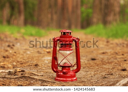 Kerosene lamp in the forest. Abstract photo