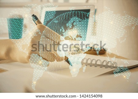 International business hud over woman's hands writing background. Concept of hard work. Double exposure
