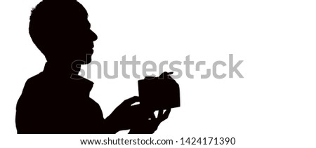 silhouette profile of a man gives a gift box with bow for his beloved, the guy congratulates on white isolated background, concept holidays, care, love, romance