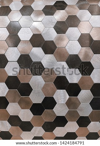 Photo top view of a multicolored mosaic for hexagon-shaped walls with metallic shine and texture as a textured background