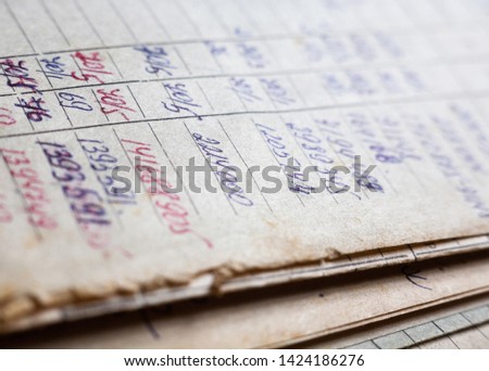 Old paper documents in the archive. Bookkeeping (accountancy). Hand-written calculations.