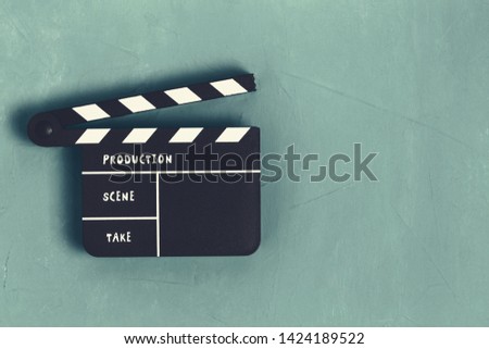 Clapper board with copy space on blue background