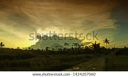 The evening scenery when the sun sets with faint mountains, and clouds                            