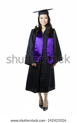 Vertical photo of young adult woman, dress in graduation gown and cap, on a white background