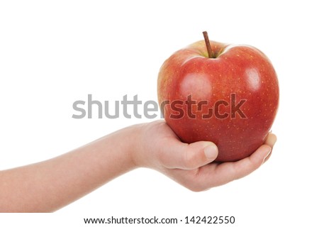 red apple in child hand isolated