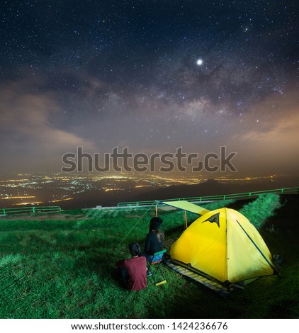 Sweet Coupleon Looking at the Stars and Milky Way in the Beautiful Night Sky (Phu Tub Berk, Phetchabun Province Thailand)