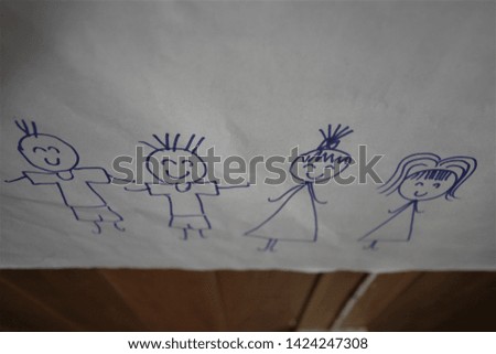 Cartoon drawings of smiling girls and and boys on paper