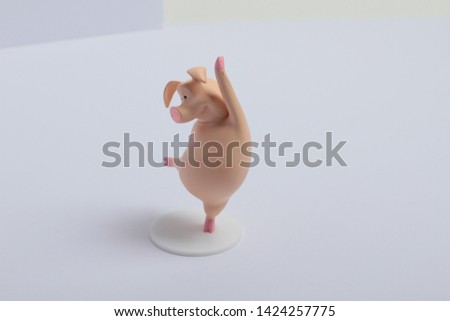 toy pink pig on white background
