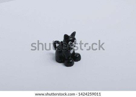 toy black cat on white background
