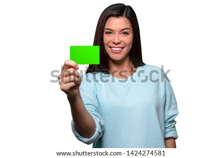 Beautiful model holding blank card, possibly credit, phone, gift, business, membership or ID card, isolated on white background