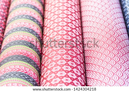 Background in colorful patterned rolls