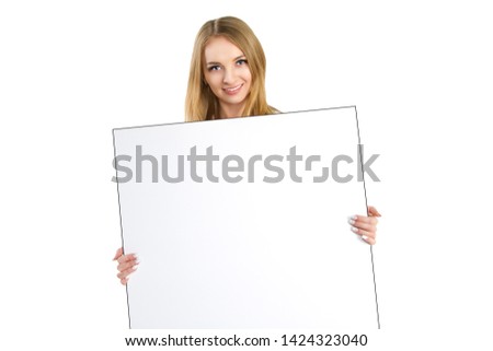 Portrait of attractive young business woman holding blank billboard isolated on white background. Caucasian female model. Beautiful woman showing blank white placard. Smiling blonde holds empty poster
