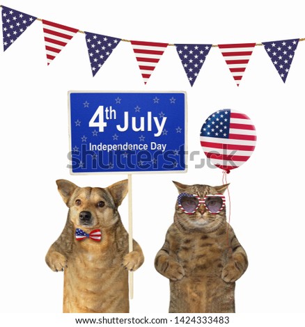 The dog patriot holds a sign (Happy Independence Day) and the cat patriotic in sunglasses holds an american balloon. White background. Isolated.