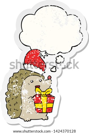 cartoon hedgehog wearing christmas hat with thought bubble as a distressed worn sticker