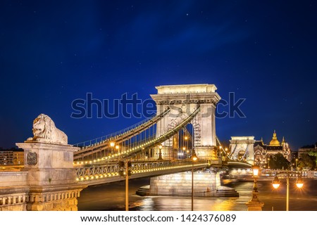 The Szechenyi Chain Bridge at night. It is a suspension bridge that spans the River Danube of Budapest, the capital of Hungary. The text "SZECHENYI LANCHID" means SZECHENYI CHAIN BRIDGE Royalty-Free Stock Photo #1424376089