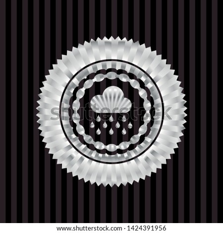 rain icon inside silvery emblem or badge