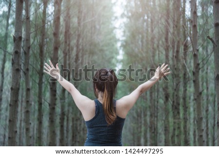 Portrait young woman lifestyle enjoying fresh air happy relaxing outdoors in green forest park