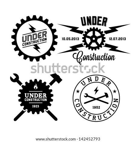 label under construction with lightning, hammer, and spanner