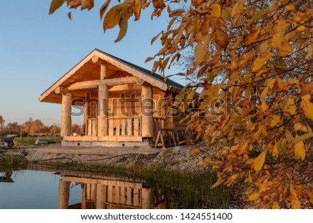 Russian wooden bath near the water in the daytime