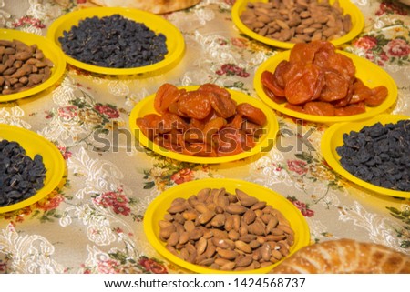 dastarkhan tablecloth covered with Oriental sweets, nuts and lavash