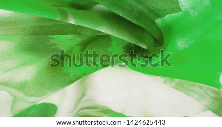 Texture, background, pattern, postcard, silk fabric, women's colored scarf with green white flowers. The gorgeous design is based on attractive background images. You will be the best