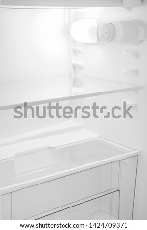 New Refrigerator Isolated on White Background. Modern Kitchen and Domestic Major Appliances