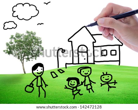 Man's hand sketching house and family on green field background