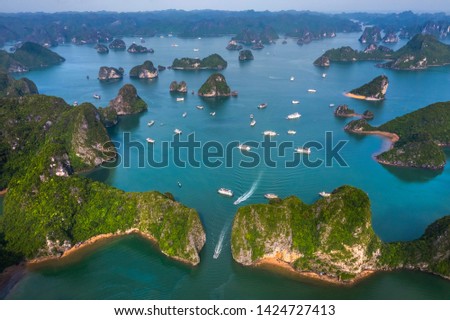 Aerial view of Ti Top rock island area from Luon cave, Halong Bay, Vietnam, Southeast Asia. UNESCO World Heritage Site. Junk boat cruise to Ha Long Bay. Popular landmark, famous destination of Vietnam Royalty-Free Stock Photo #1424727413