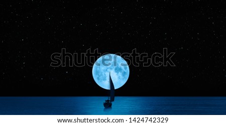 Full blue moon with lone yacht  "Elements of this image furnished by NASA " 