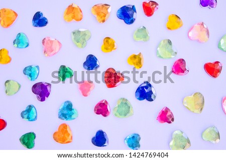 Beautiful colored pebble hearts top view
