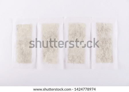 Leg hair removal pad on the white floor
