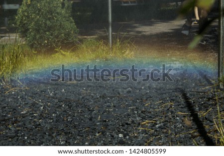 Rainbow in the street, lucky sign