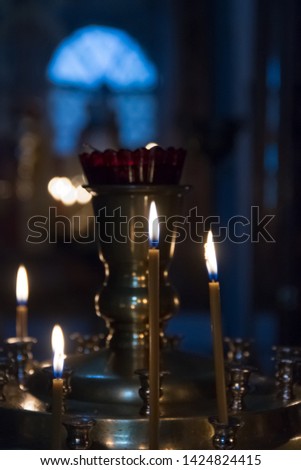 Candles in the Orthodox Church. Lighted candles during a Church prayer.