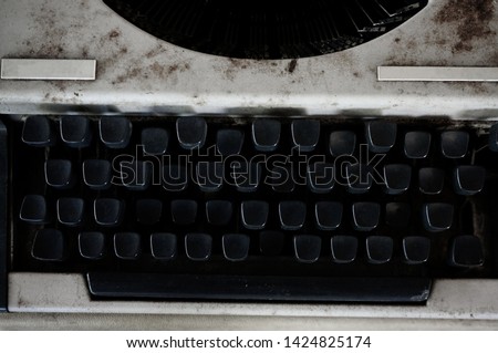 old and dusty typewriter in black color