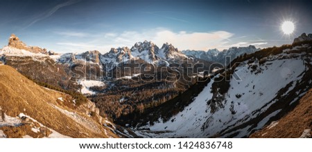 panoramic scenic landscape in tre cime di lavaredo dolomites mountain range in sunny snowy winter 