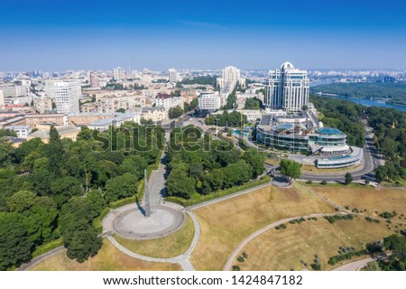 Aerial view of blue river and green forests on a sunny summer day. Kiev, Ukraine